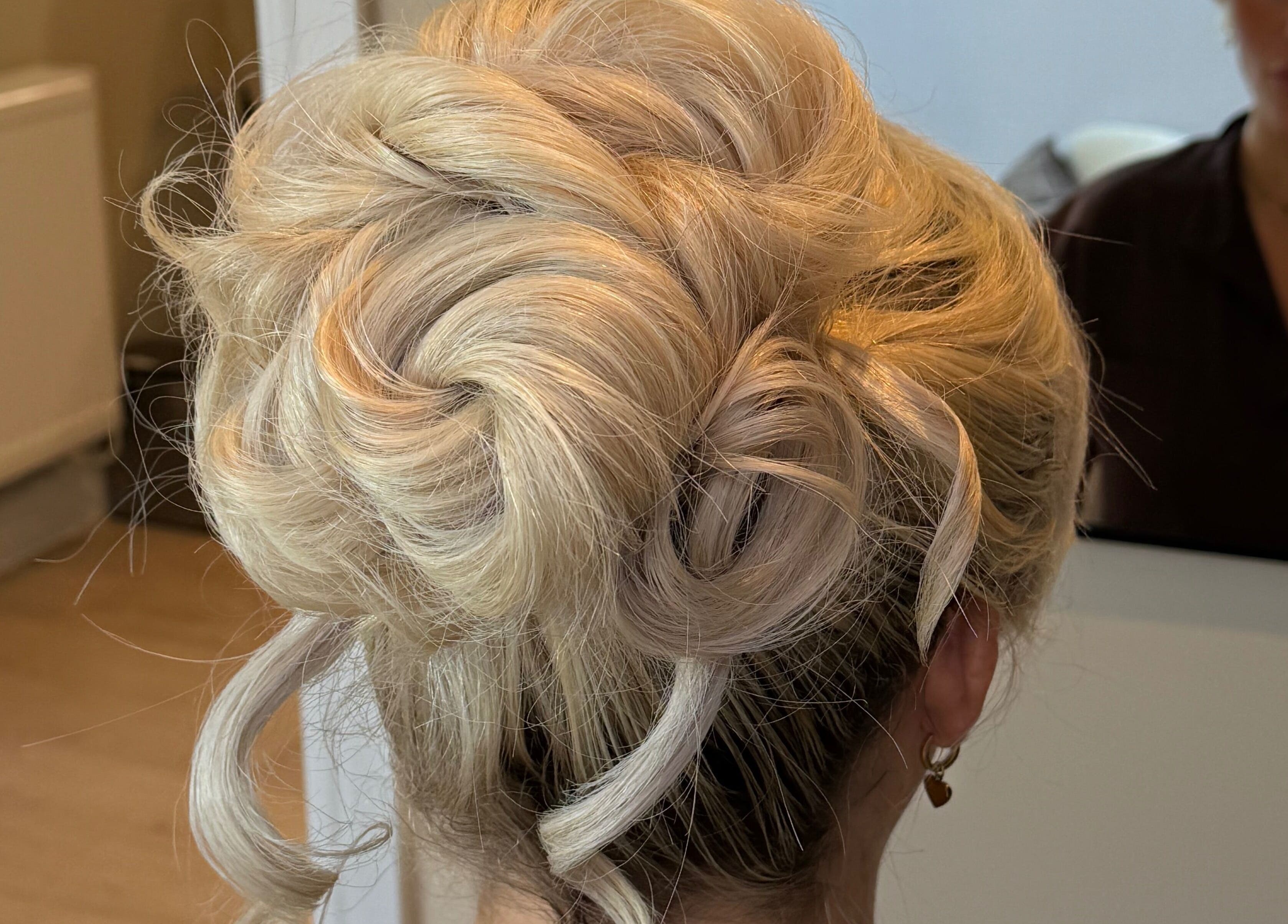 Stunning blonde updo hairstyle at Pinned By Emily, Cefn-mawr, Wales, GB salon.