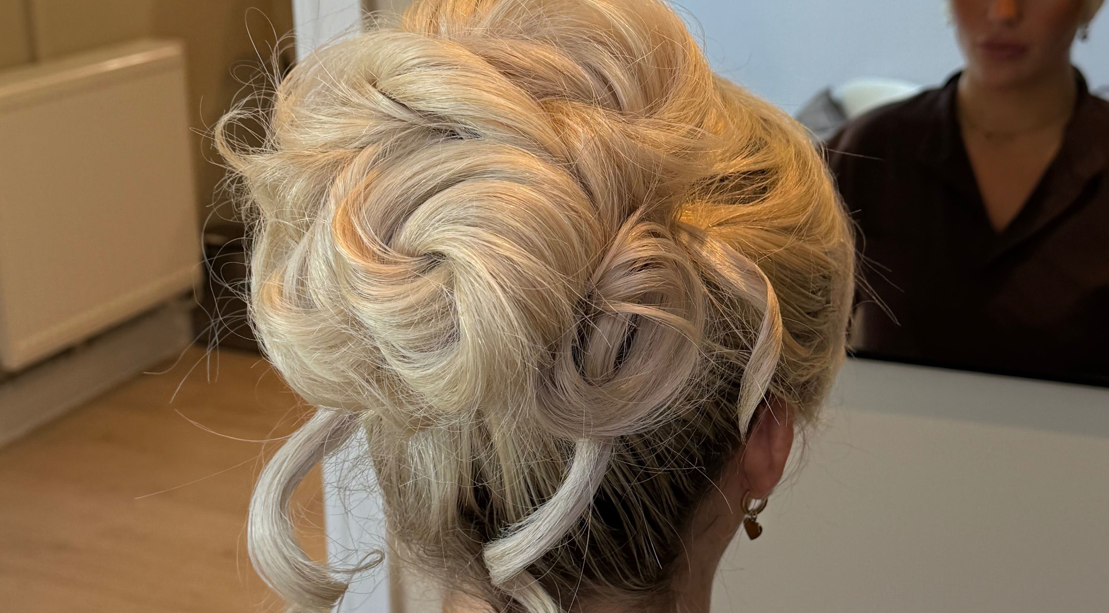 Stunning blonde updo hairstyle at Pinned By Emily, Cefn-mawr, Wales, GB salon.
