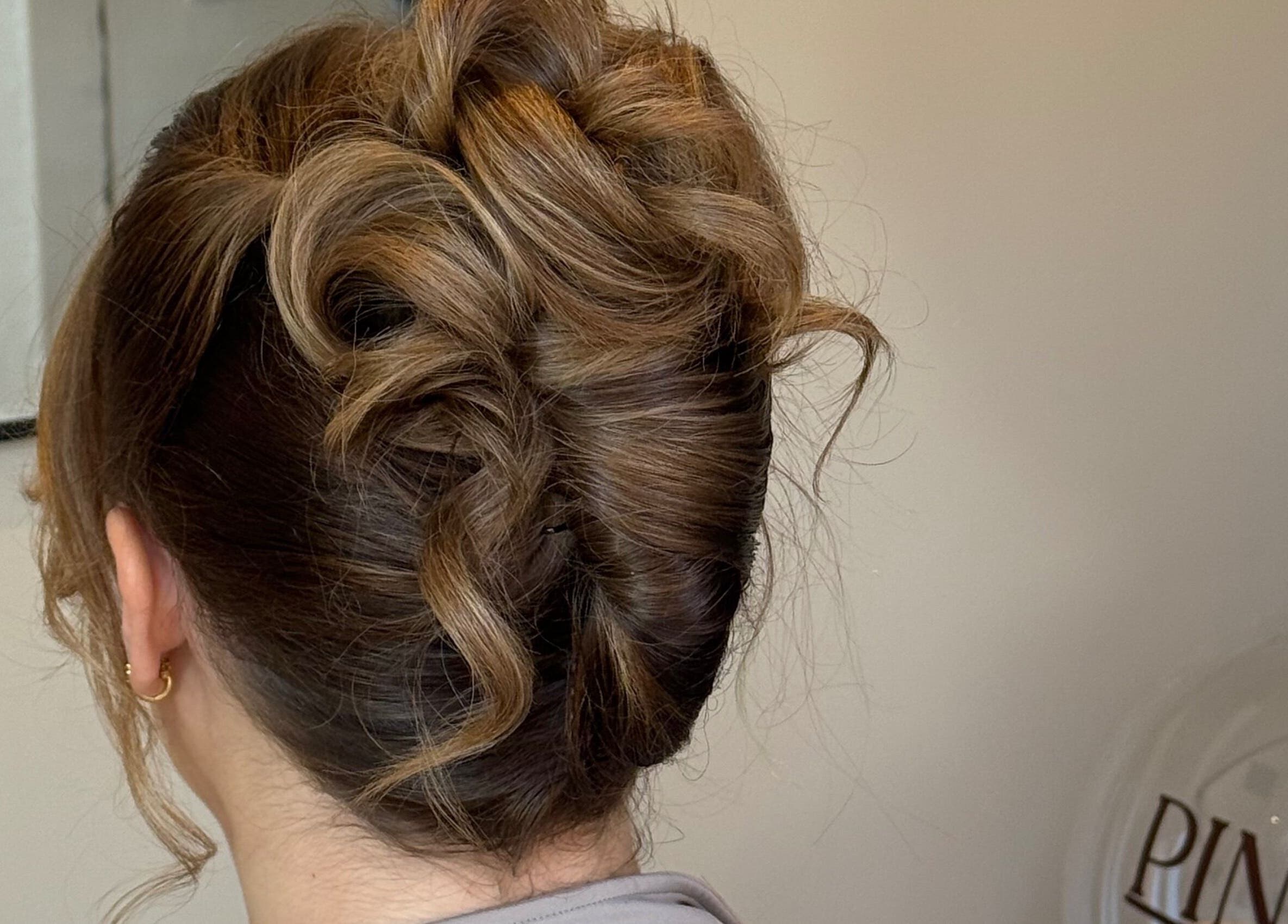 Elegant brown updo hairstyle at Pinned By Emily, Cefn-mawr, Wales, GB salon.