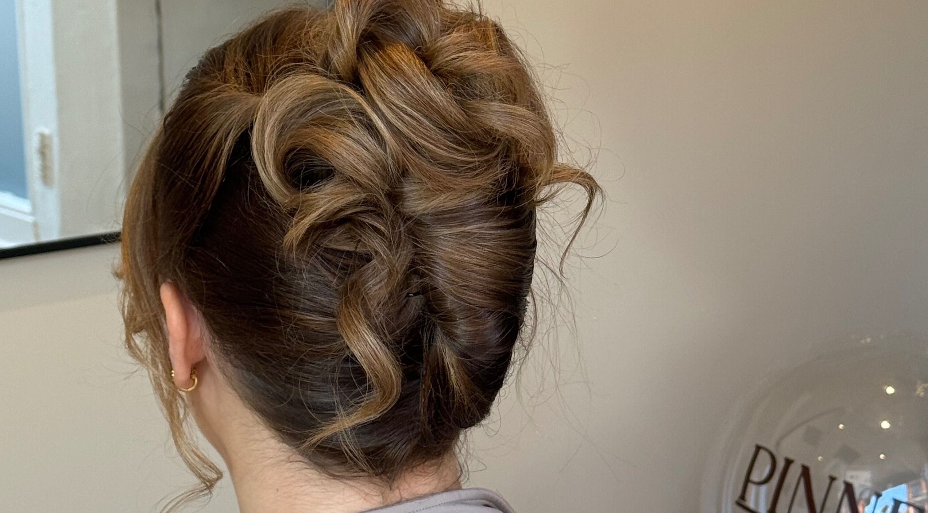 Elegant brown updo hairstyle at Pinned By Emily, Cefn-mawr, Wales, GB salon.