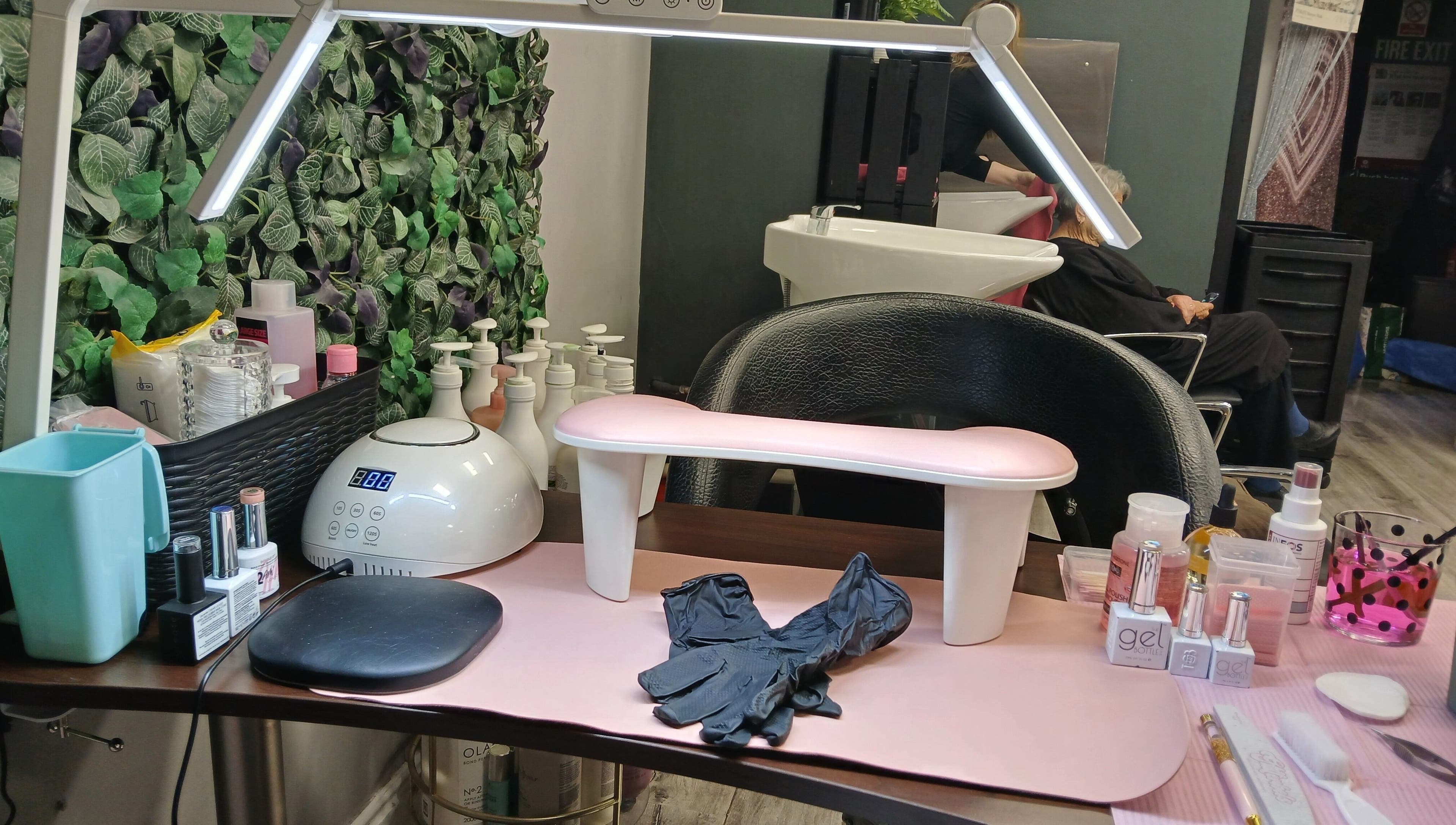 Modern manicuring station at Nurture & Nails by Kati, Darlington, England, GB, showcasing tools and nail polishes.