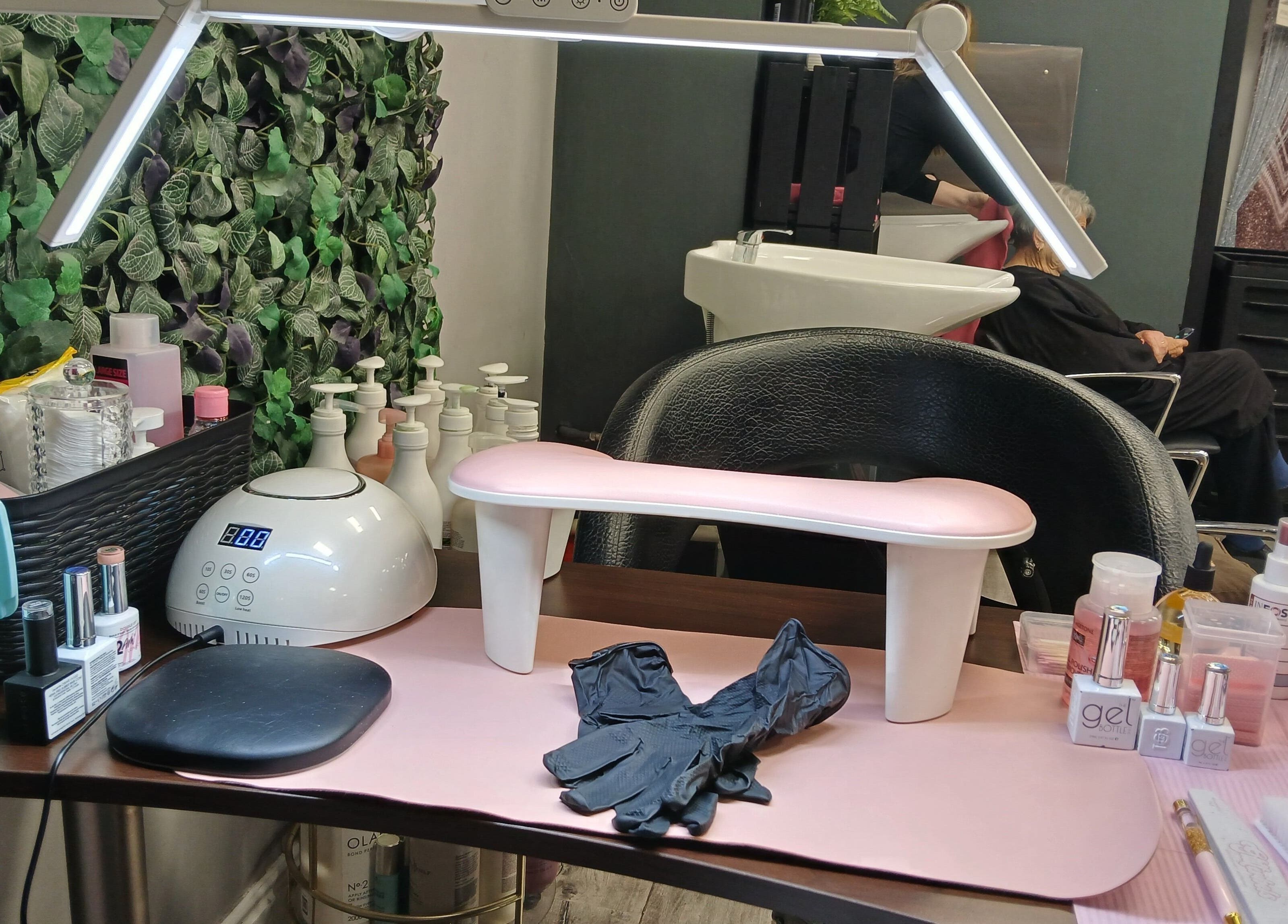 Modern manicuring station at Nurture & Nails by Kati, Darlington, England, GB, showcasing tools and nail polishes.