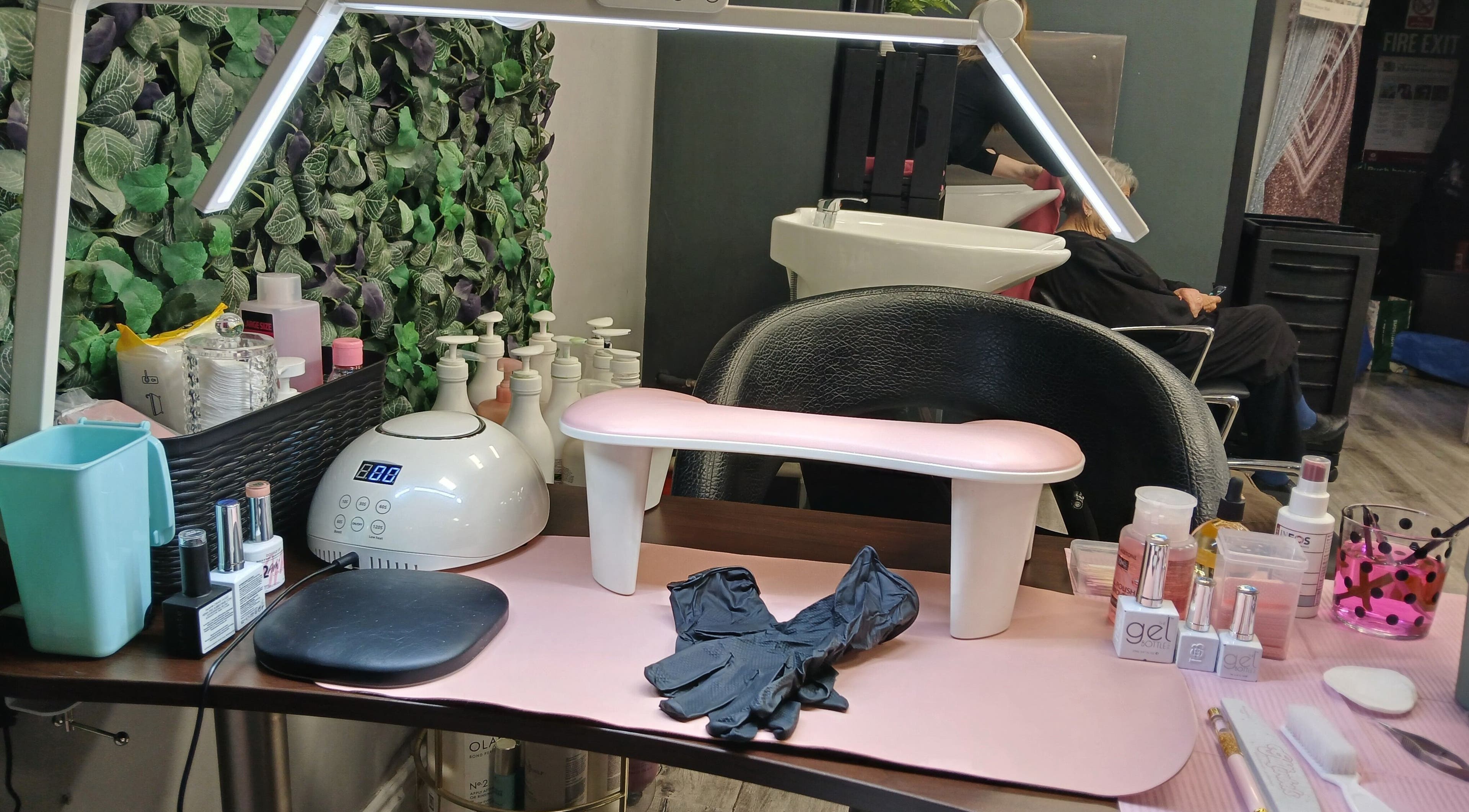 Modern manicuring station at Nurture & Nails by Kati, Darlington, England, GB, showcasing tools and nail polishes.