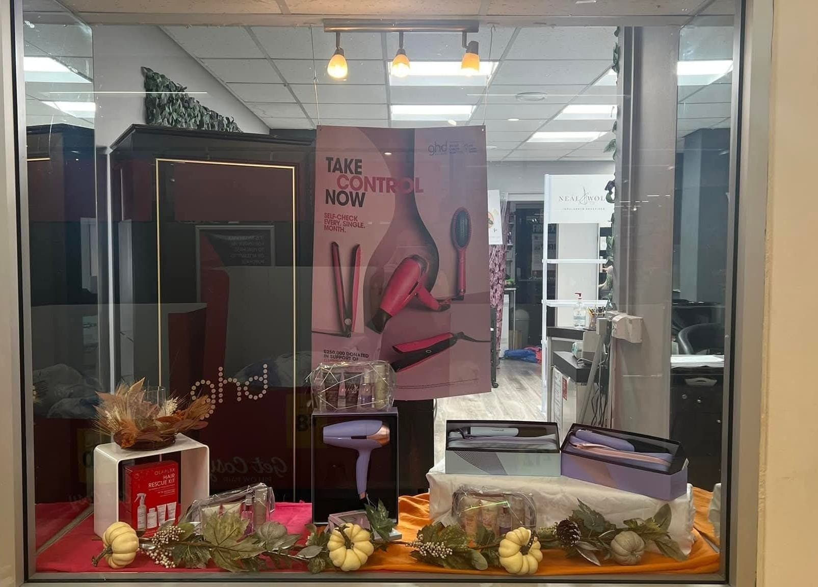 Stylish window display at Nurture & Nails by Kati, Darlington, England, GB featuring hair care products.