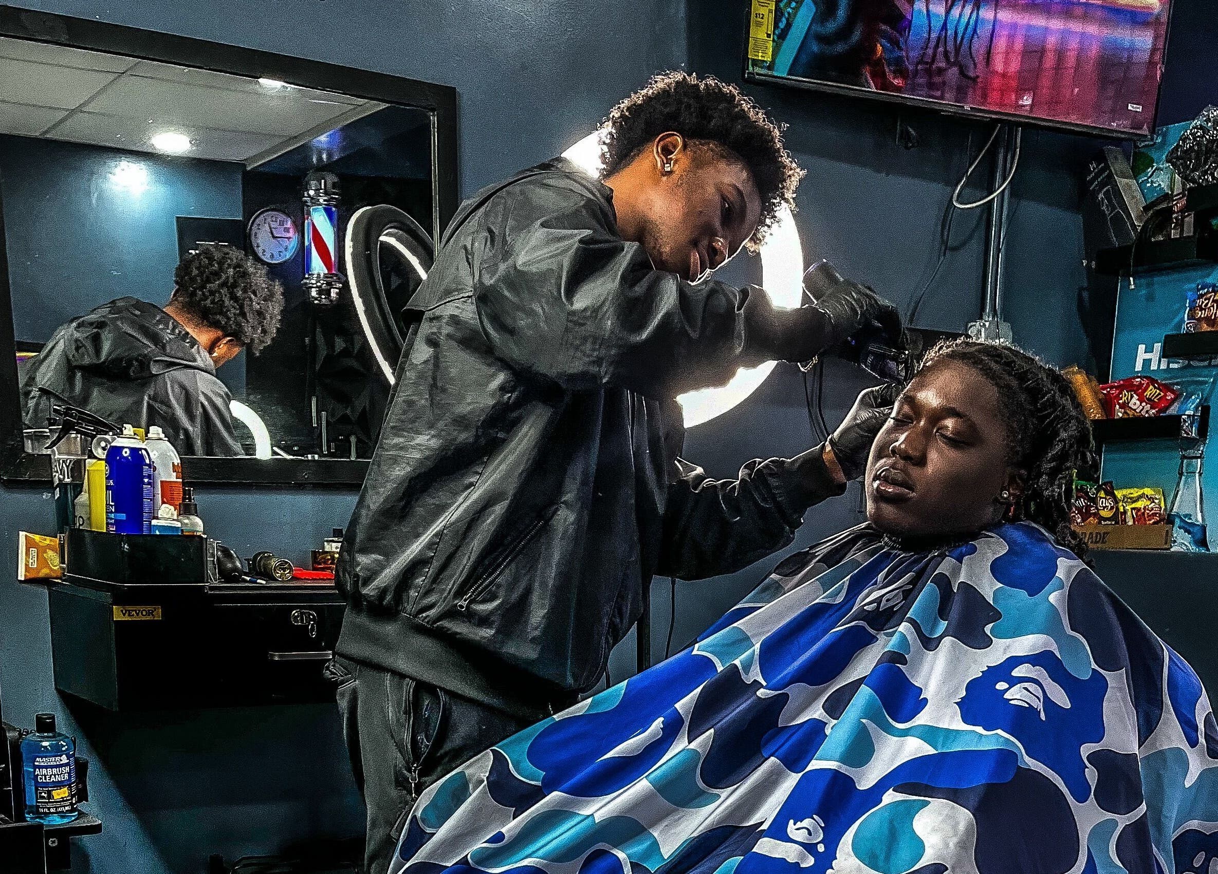 Stylist crafting a fresh look at The LoFade Experience, Nassau, New Providence, BS.