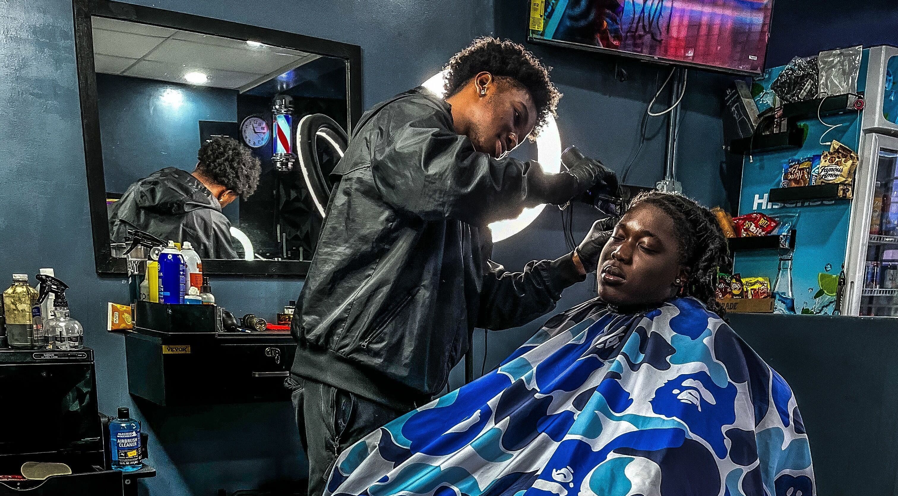 Stylist crafting a fresh look at The LoFade Experience, Nassau, New Providence, BS.