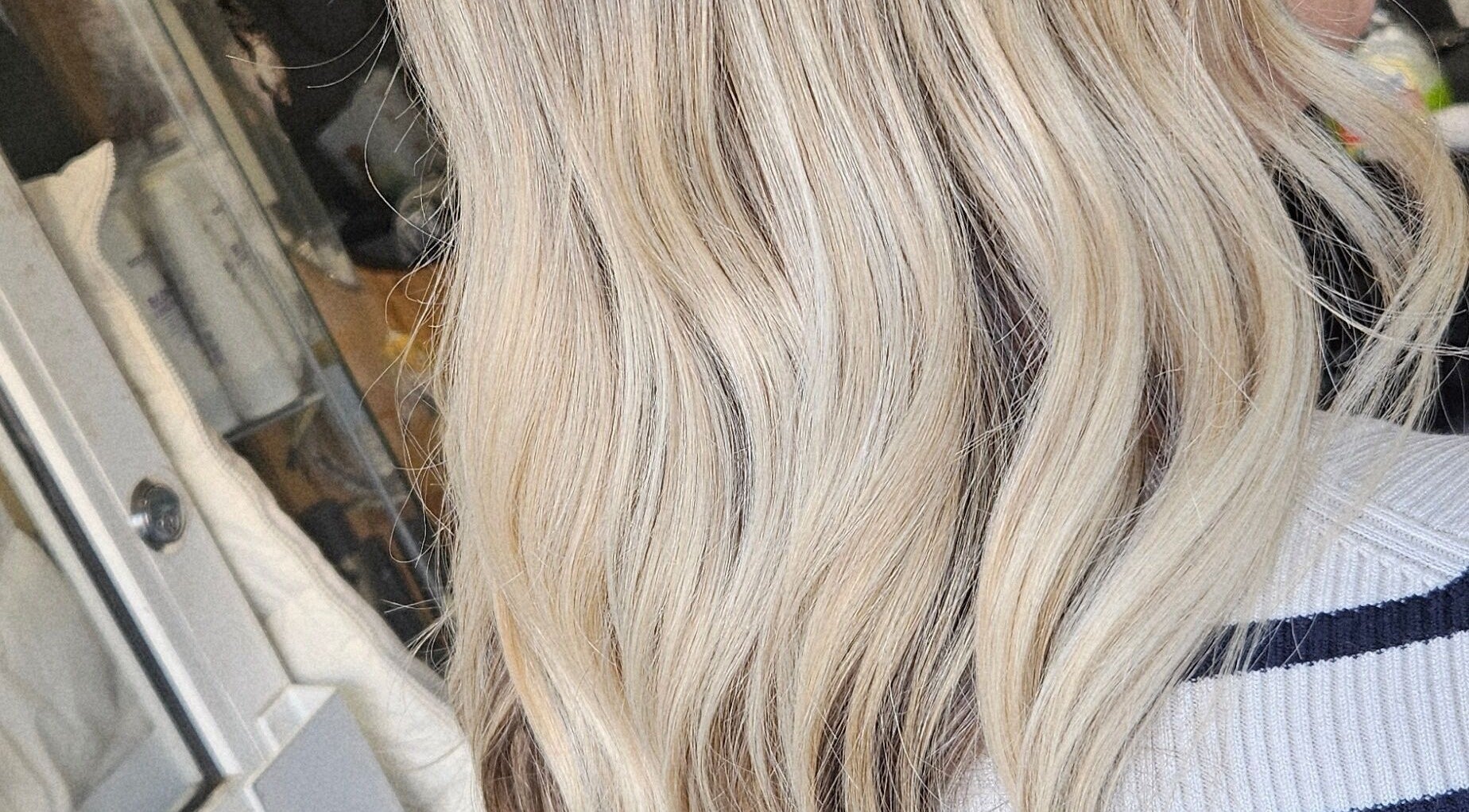 Blonde wavy hairstyle by Hair by danielle @all about you, Armadale, Scotland, GB. Sleek, stylish, and vibrant.