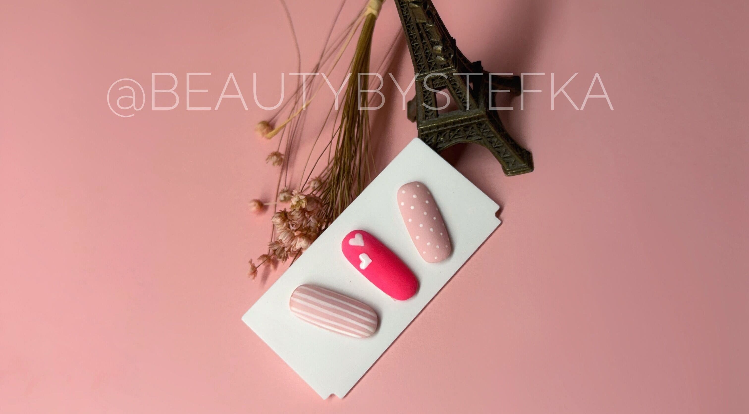 Elegant pink nail designs at SKA.NAILS, Norwich, England, GB on a delicate background.