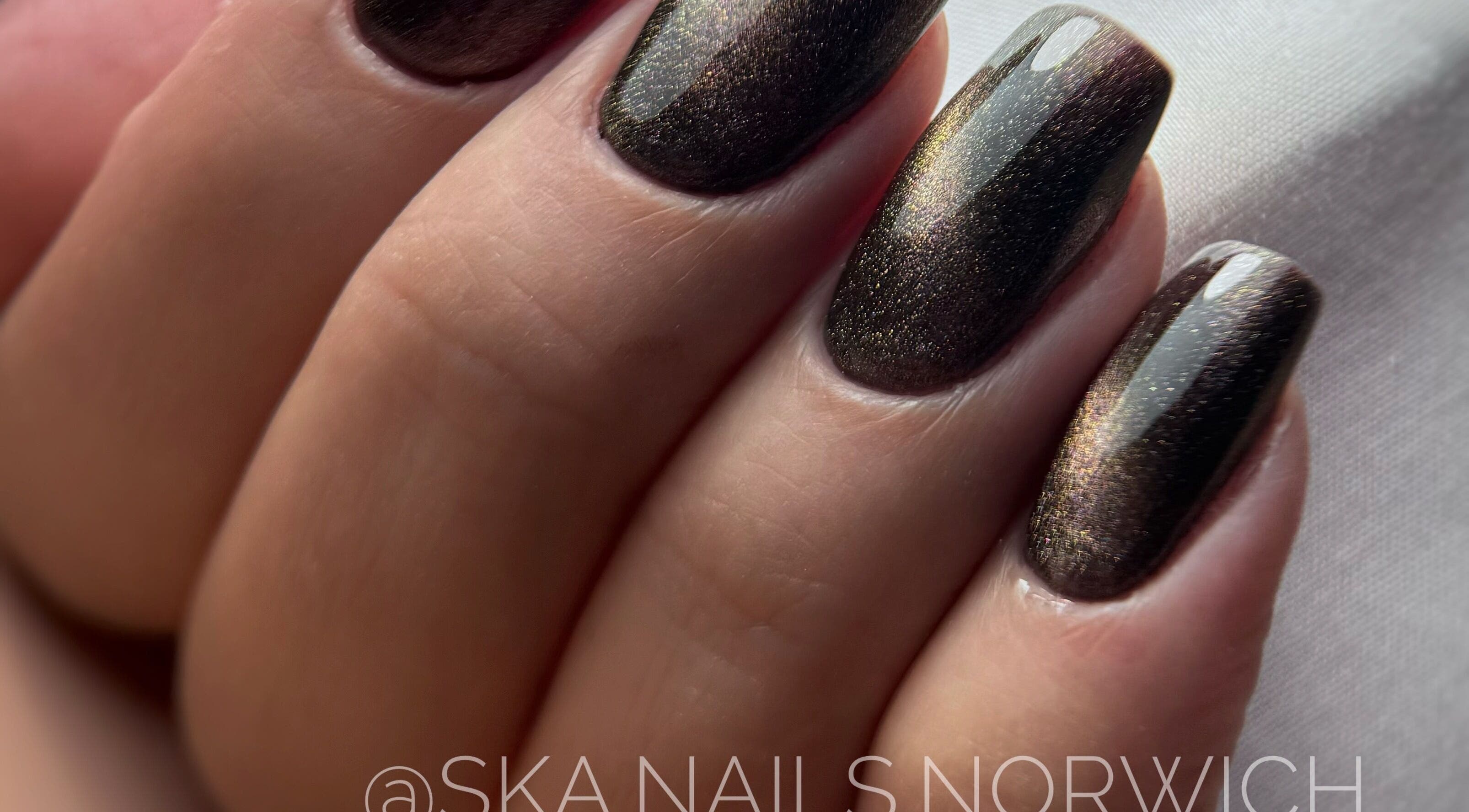 Elegant dark metallic nails from SKA.NAILS, Norwich, England, GB. Perfect for a sophisticated look.