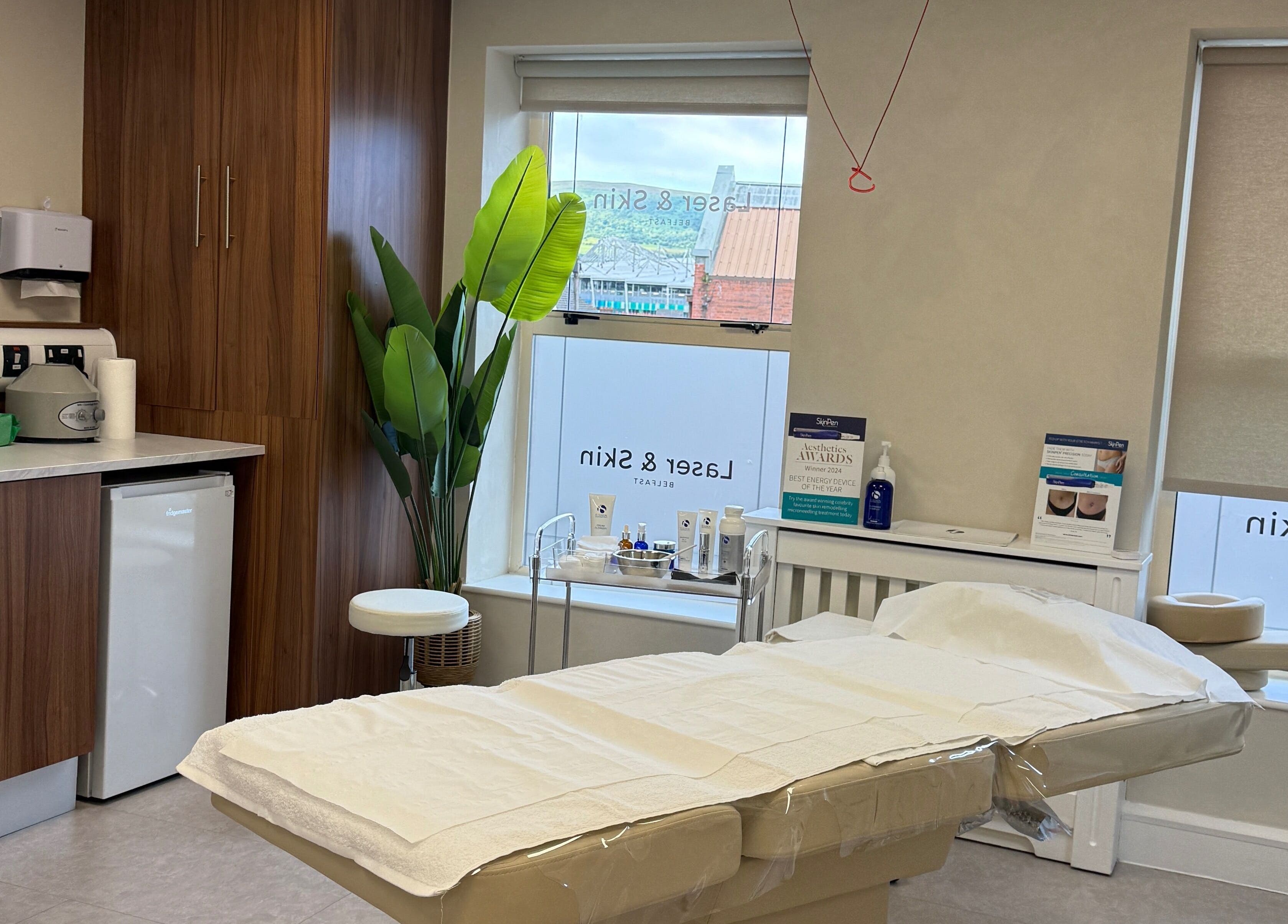 Relaxing treatment room at Laser & Skin Belfast, showcasing modern decor and facilities in Belfast, Northern Ireland, GB.