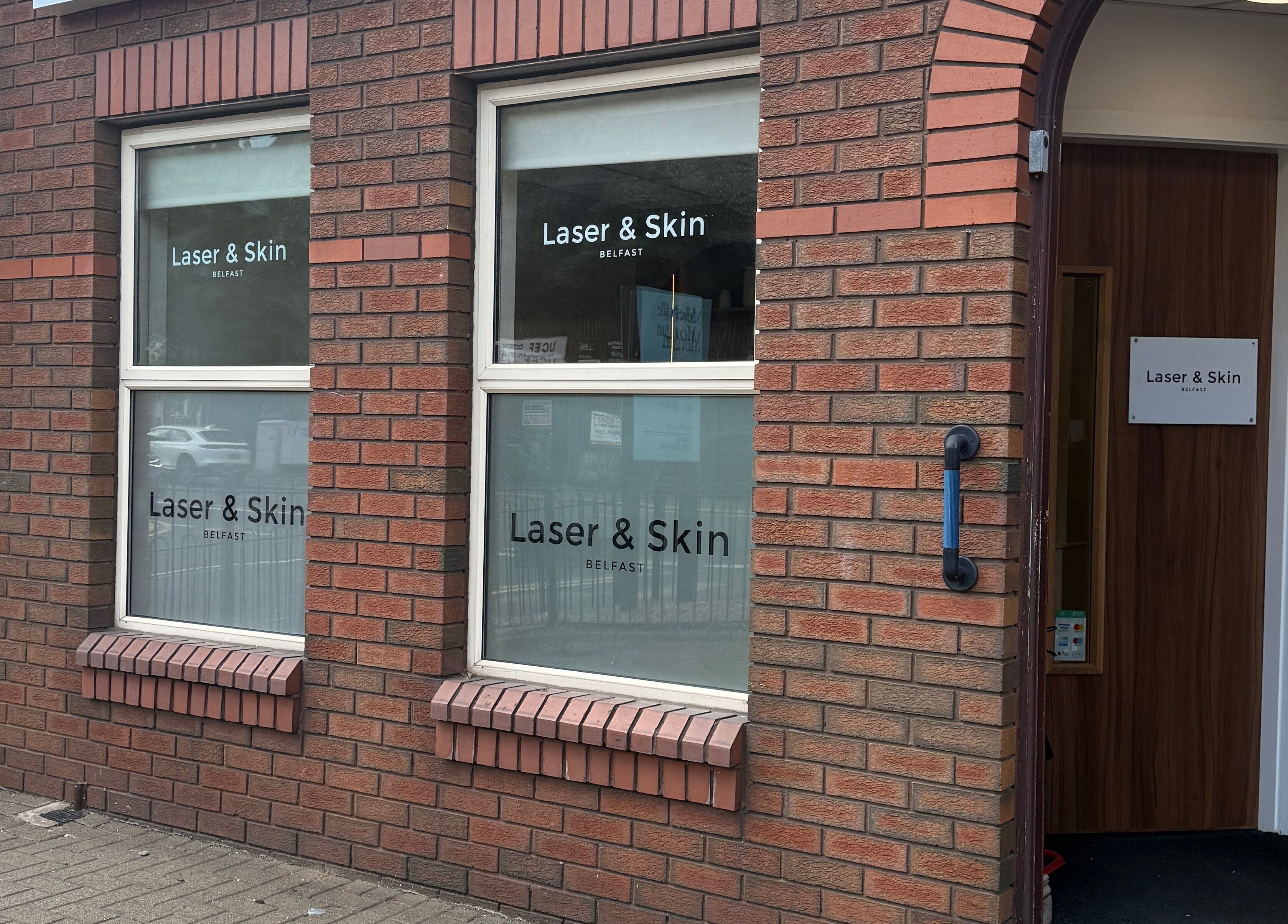 Entrance of Laser & Skin Belfast, Northern Ireland, GB, showcasing their inviting storefront with stylish signage.