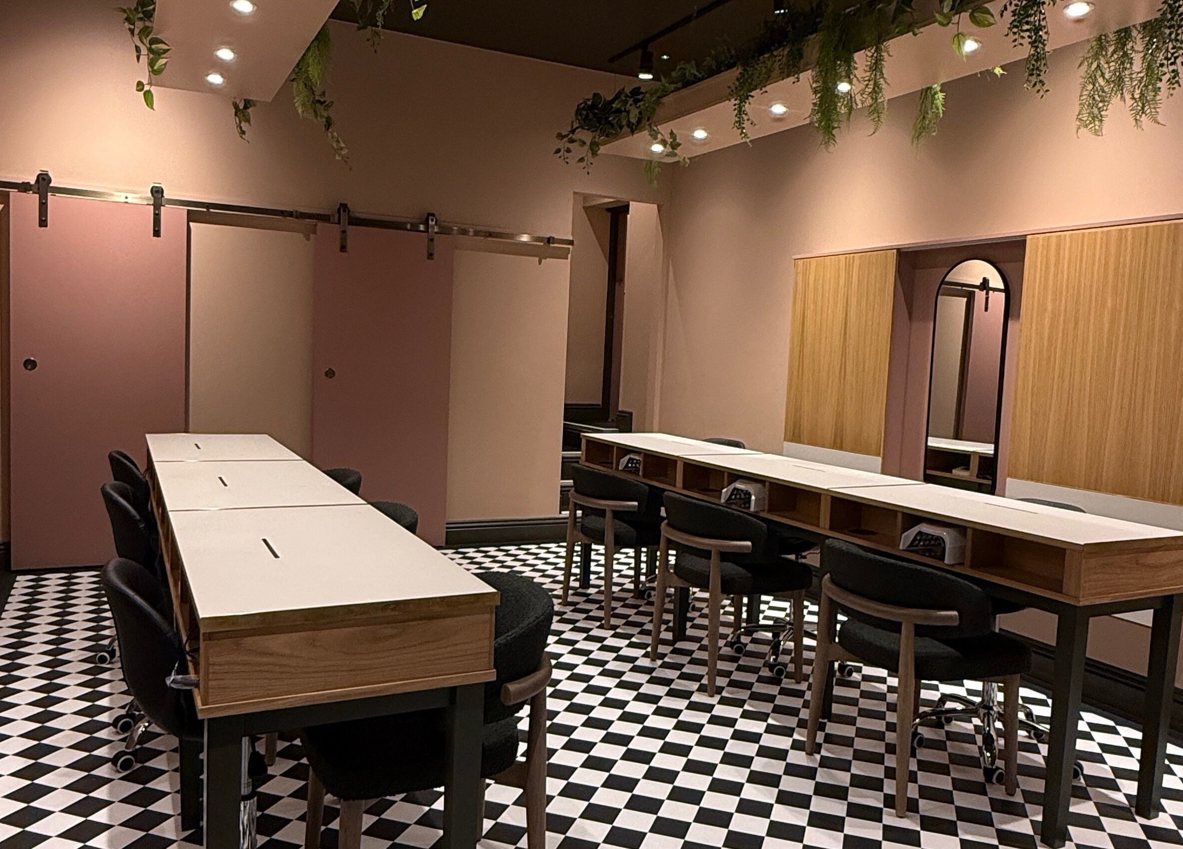 Stylish interior of GOLDFINCH NAILS STUDIO in Haslemere, England, GB, featuring elegant decor and spacious seating.