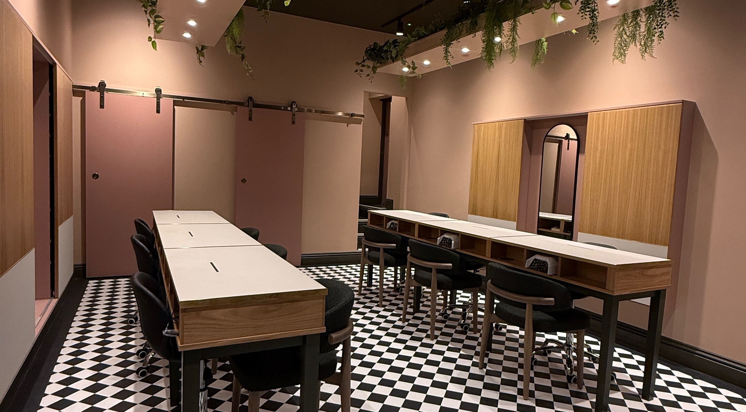 Stylish interior of GOLDFINCH NAILS STUDIO in Haslemere, England, GB, featuring elegant decor and spacious seating.