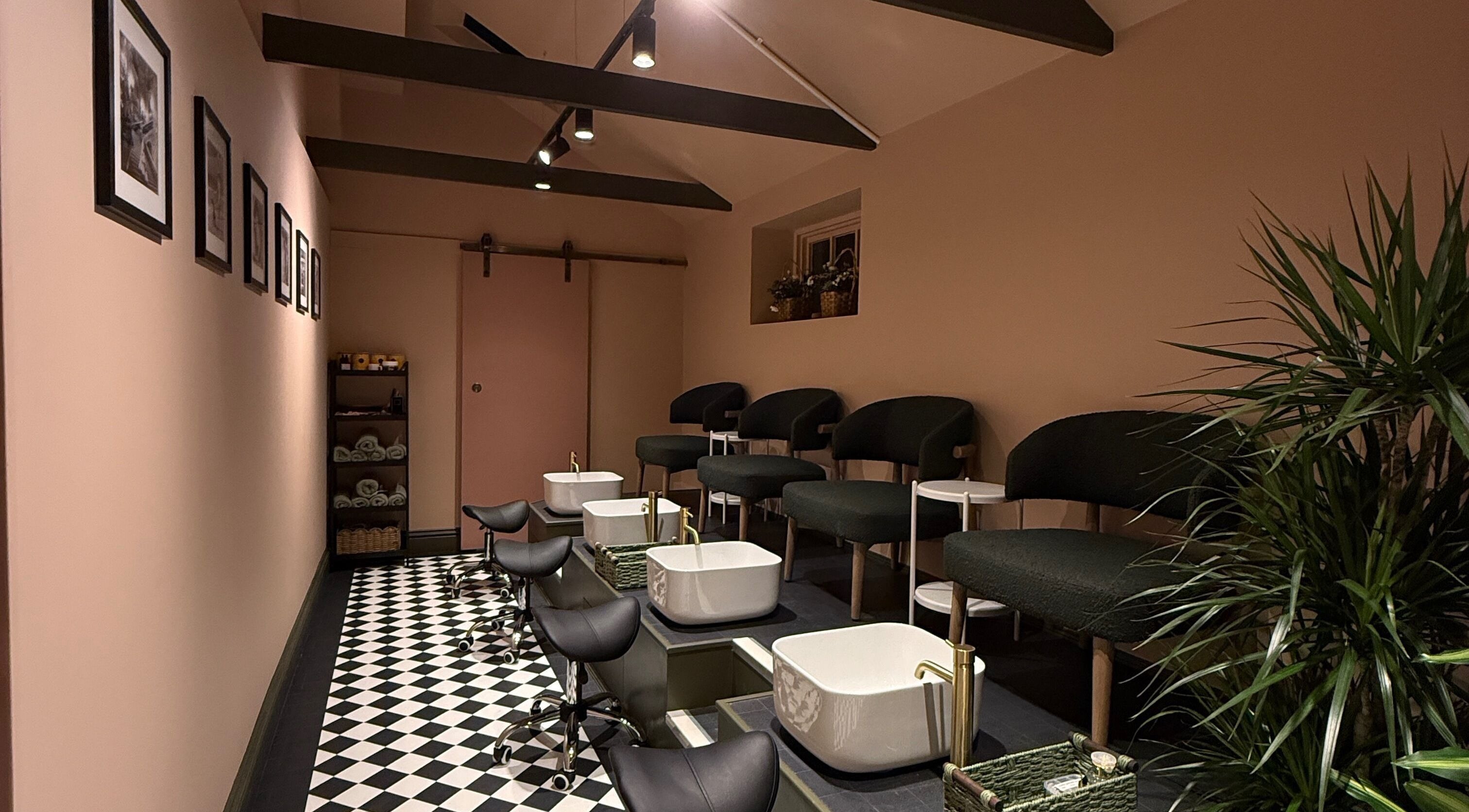 GOLDFINCH NAILS STUDIO in Haslemere, England, features chic pedicure stations with stylish decor and cozy seating.