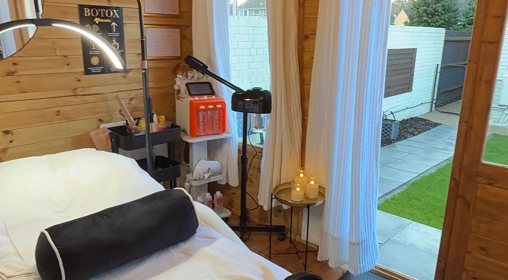 Inviting treatment room at Boutique Brows & Beauty, Verwood, England, GB with serene outdoor view.