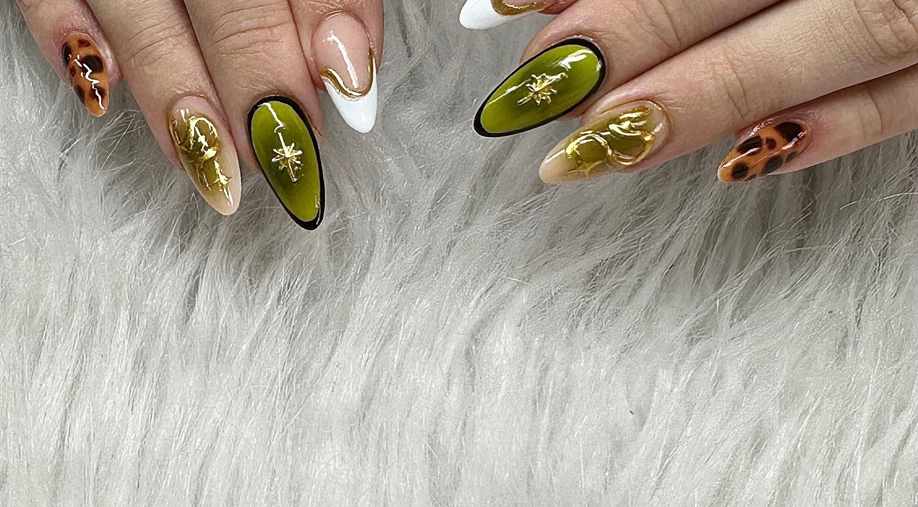 Stylish artistic nails at Jenny's in Hinckley, England, GB showcasing unique and vibrant designs.