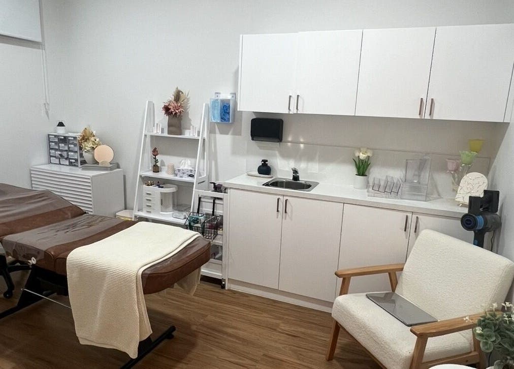 Meliaesthetics treatment room with massage table and modern decor, Melbourne, Victoria, AU.