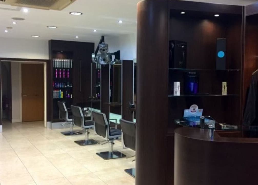 Modern interior of RG Hairdressing in Bramhope, England, GB, showcasing stylish salon chairs and chic decor.