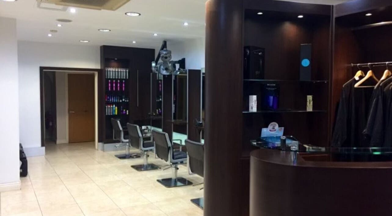 Modern interior of RG Hairdressing in Bramhope, England, GB, showcasing stylish salon chairs and chic decor.