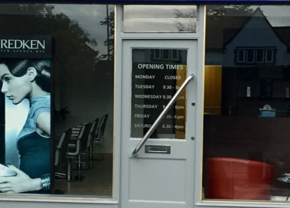 Front view of RG Hairdressing in Bramhope, England with modern design and operating hours displayed.