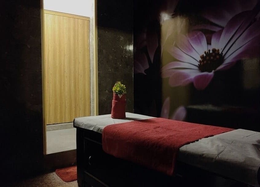 Relaxing massage room at Sunset Massage Service in Bangalore, IN with calming decor and ambiance.