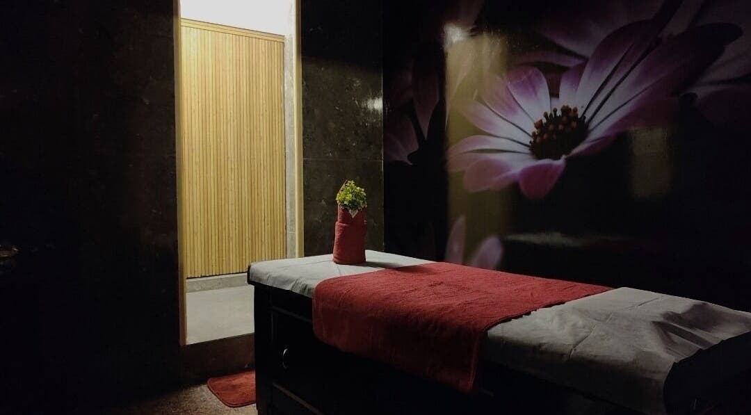 Relaxing massage room at Sunset Massage Service in Bangalore, IN with calming decor and ambiance.