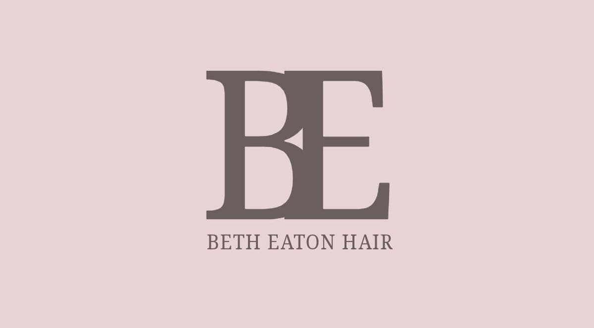 Logo of Beth Eaton Hair in Halesowen, England, GB featuring stylized initials 'BE' on a pink background.