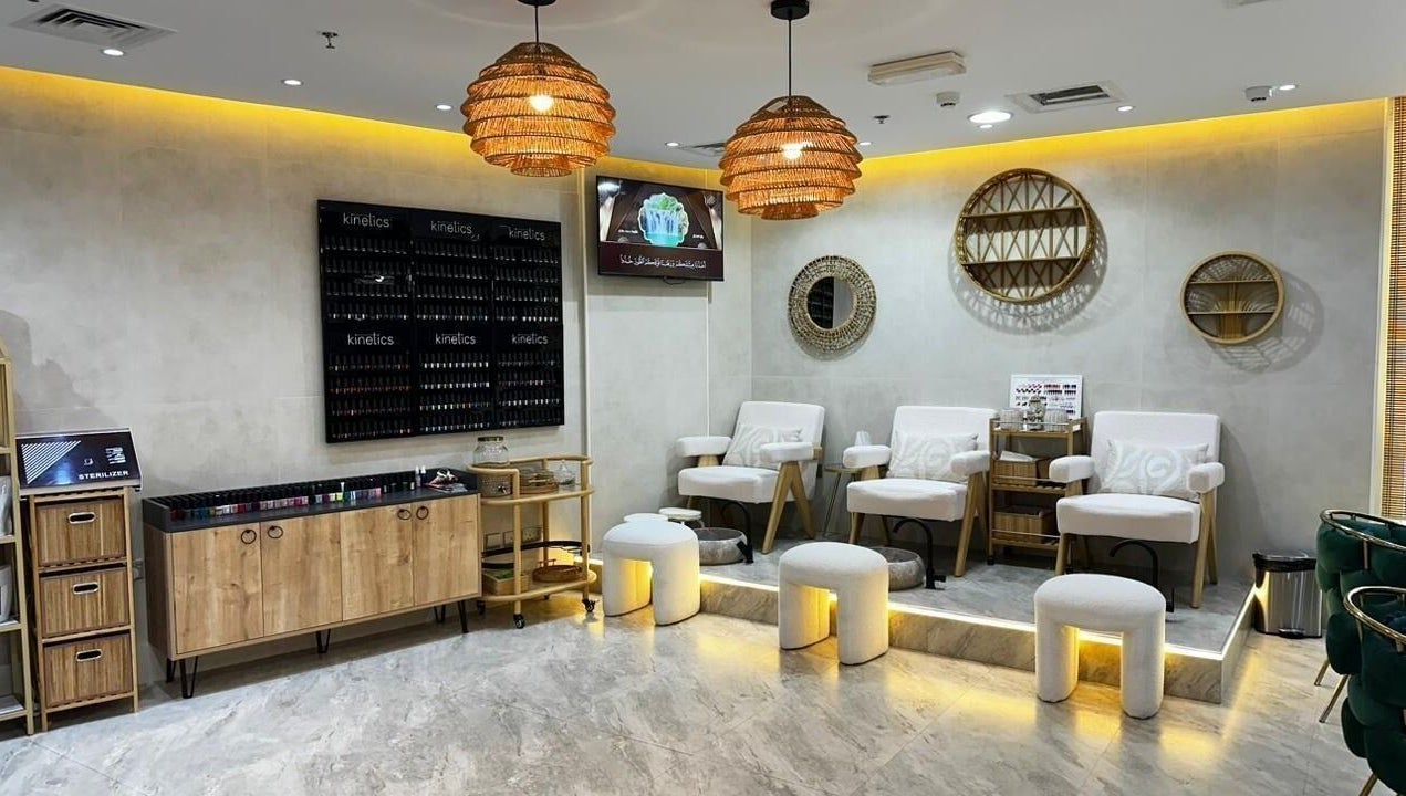 Elegant seating area at Bronzette Beauty Salon L.L.C, Dubai, AE with chic decor and warm lighting.
