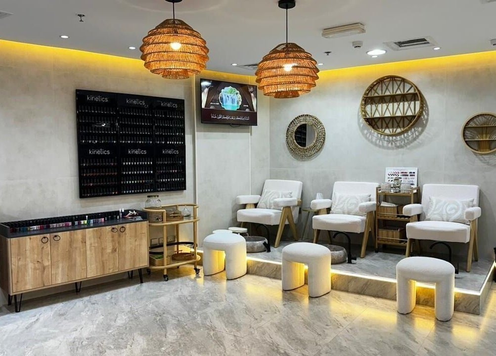 Elegant seating area at Bronzette Beauty Salon L.L.C, Dubai, AE with chic decor and warm lighting.