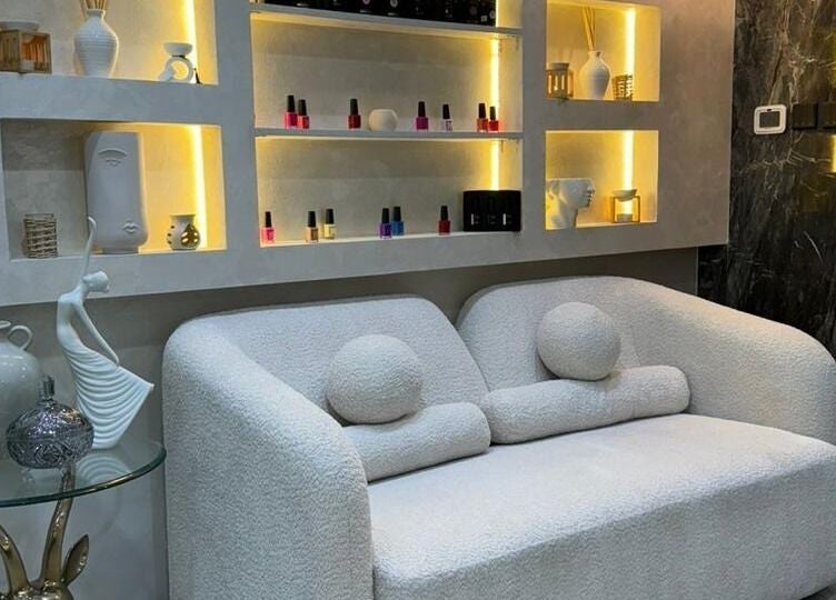 Elegant nail polish display at Bronzette Beauty Salon L.L.C, Dubai, AE, with comfortable seating.