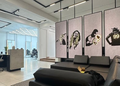 Modern interior of Raula Barbershop Rajagiriya in Sri Jayawardenepura Kotte, Western Province, LK showcasing art panels.