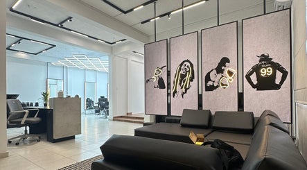 Modern interior of Raula Barbershop Rajagiriya in Sri Jayawardenepura Kotte, Western Province, LK showcasing art panels.