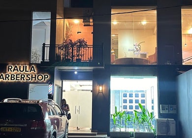 Raula Barbershop Rajagiriya's illuminated exterior at Sri Jayawardenepura Kotte, Western Province, LK.