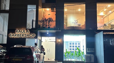 Raula Barbershop Rajagiriya's illuminated exterior at Sri Jayawardenepura Kotte, Western Province, LK.