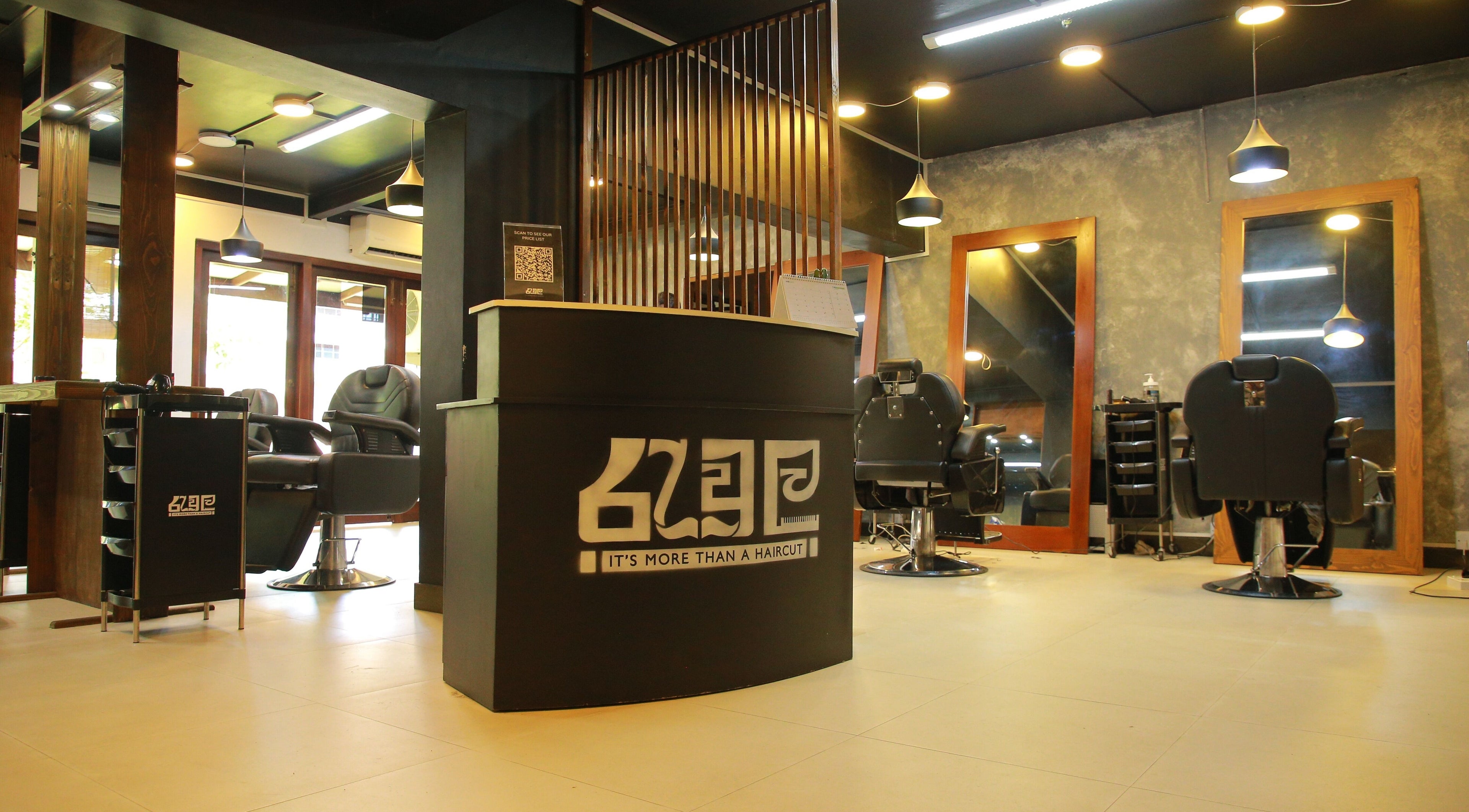Modern interior of Raula Barbershop Park Road in Colombo, Western Province, LK with sleek chairs and mirrors.