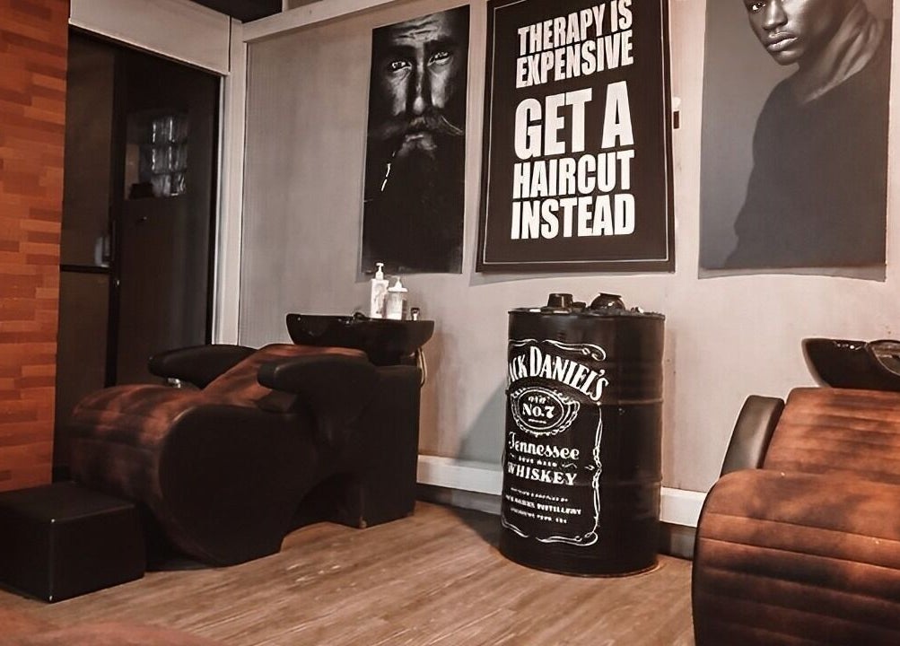 Stylish interior of Raula Barbershop Baseline Road in Colombo, Western Province, LK with barber chairs and edgy decor.