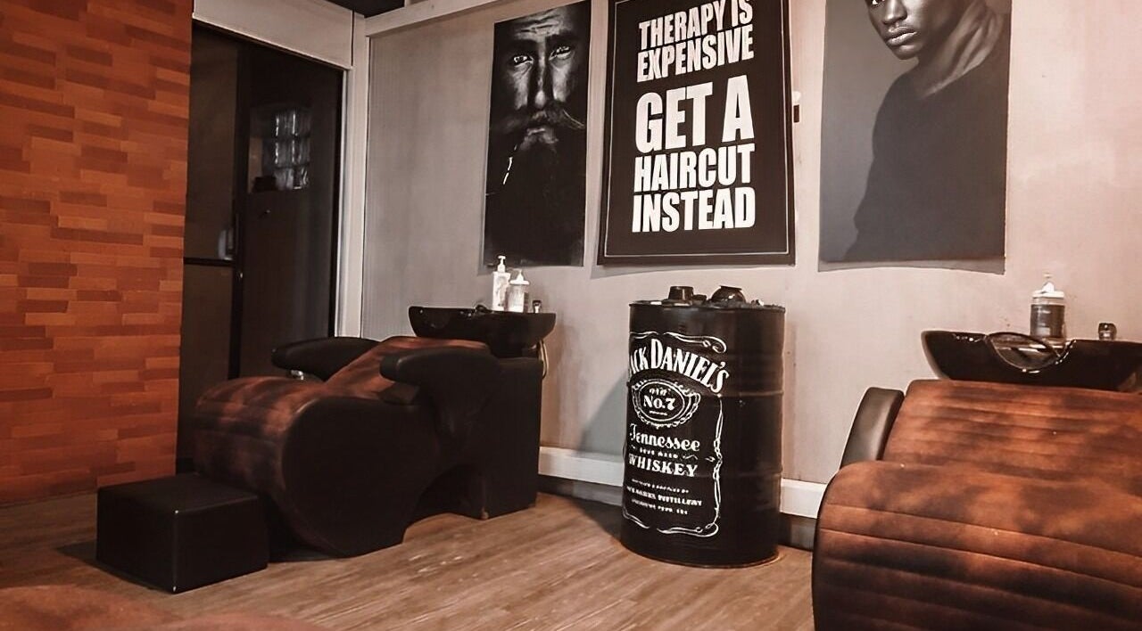 Stylish interior of Raula Barbershop Baseline Road in Colombo, Western Province, LK with barber chairs and edgy decor.