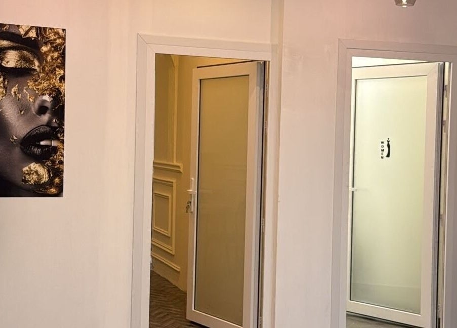 Elegant hallway at Stellar Beauty, adorned with modern art in Doha, Doha Municipality, QA.