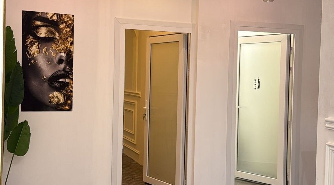 Elegant hallway at Stellar Beauty, adorned with modern art in Doha, Doha Municipality, QA.