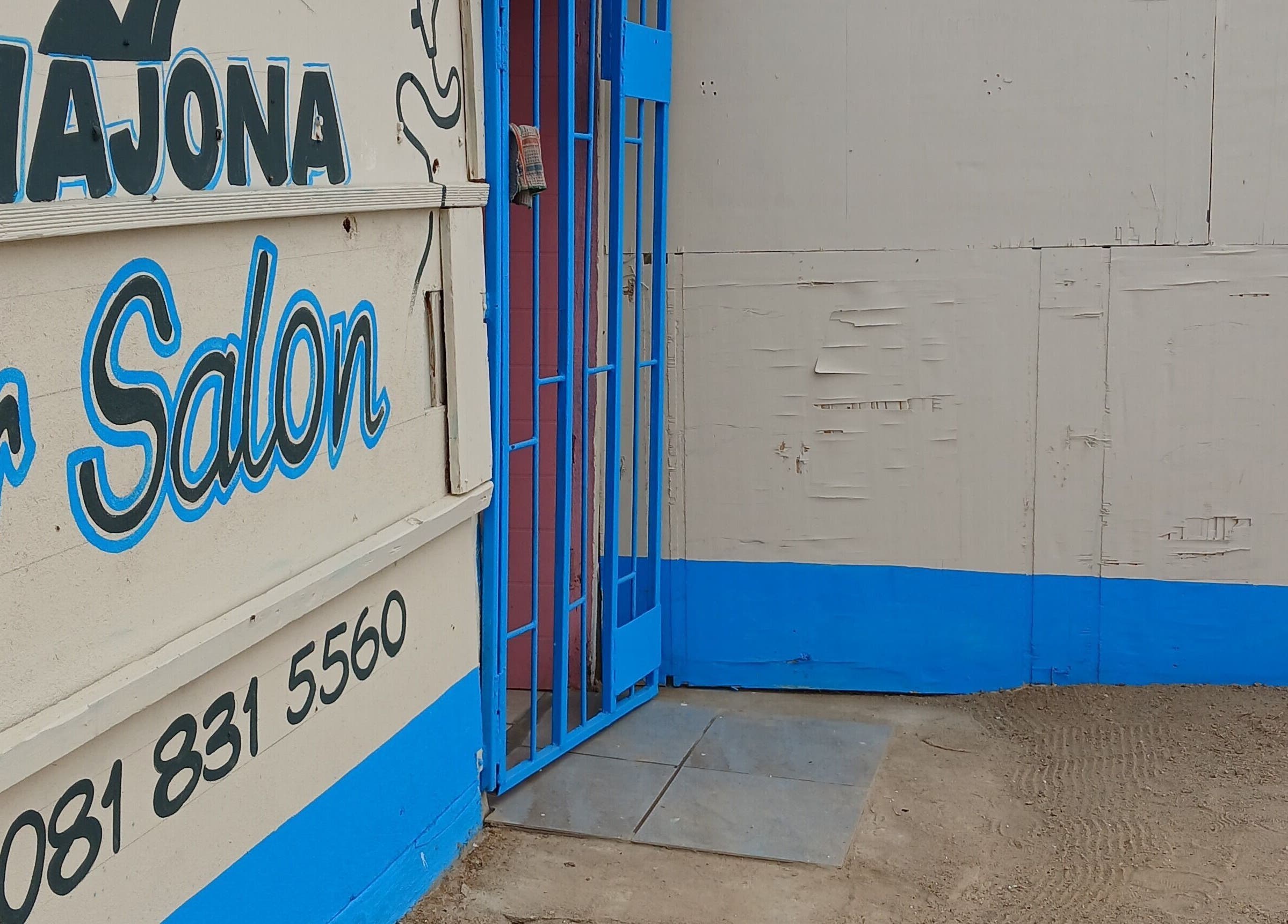 Majona Hairsalon's entrance in Swakopmund, Erongo Region, NA, with bold blue and white signage.