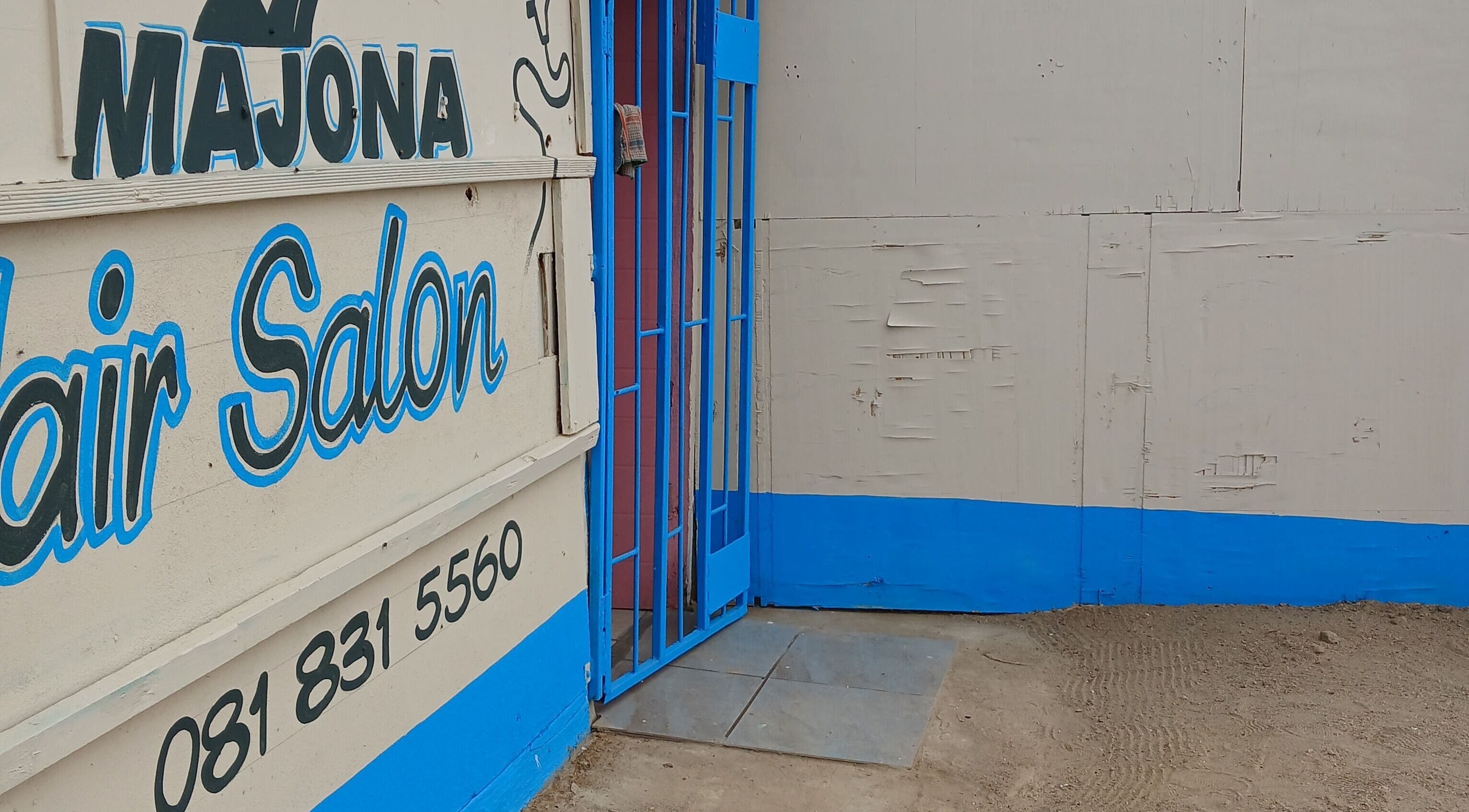 Majona Hairsalon's entrance in Swakopmund, Erongo Region, NA, with bold blue and white signage.