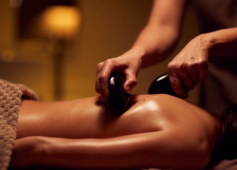 Hot stone massage at Venus Holistic Therapies at Prana Voice, London, England, GB for relaxation and wellness.