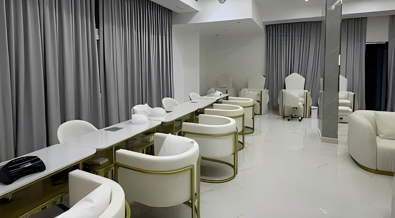 Chic interior of La Bella Beauty Center & Spa in Sharjah, AE, showcasing plush seating and elegant decor.