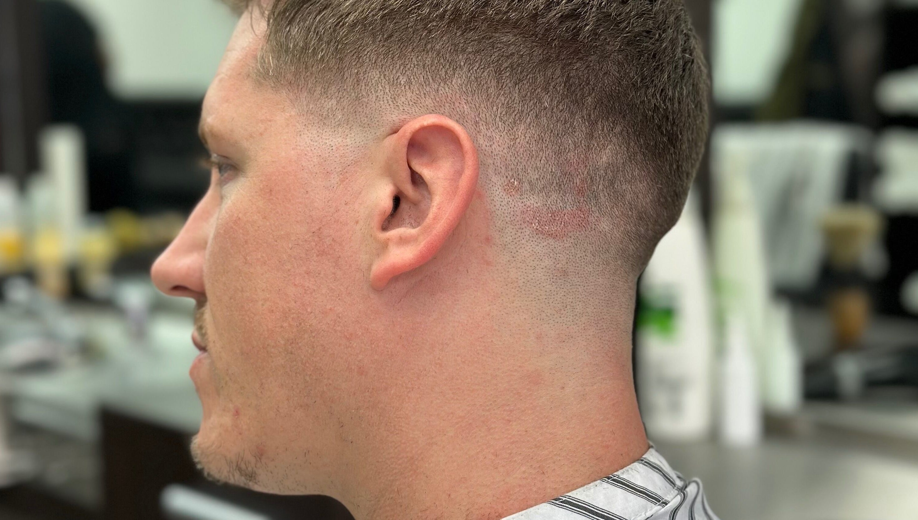 Close-up of a man's fresh fade haircut at Golden Scissors, Birmingham, England, GB.