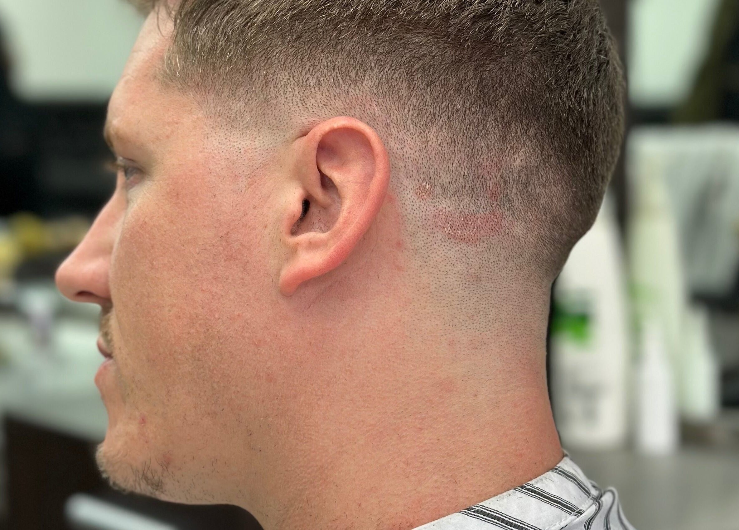 Close-up of a man's fresh fade haircut at Golden Scissors, Birmingham, England, GB.