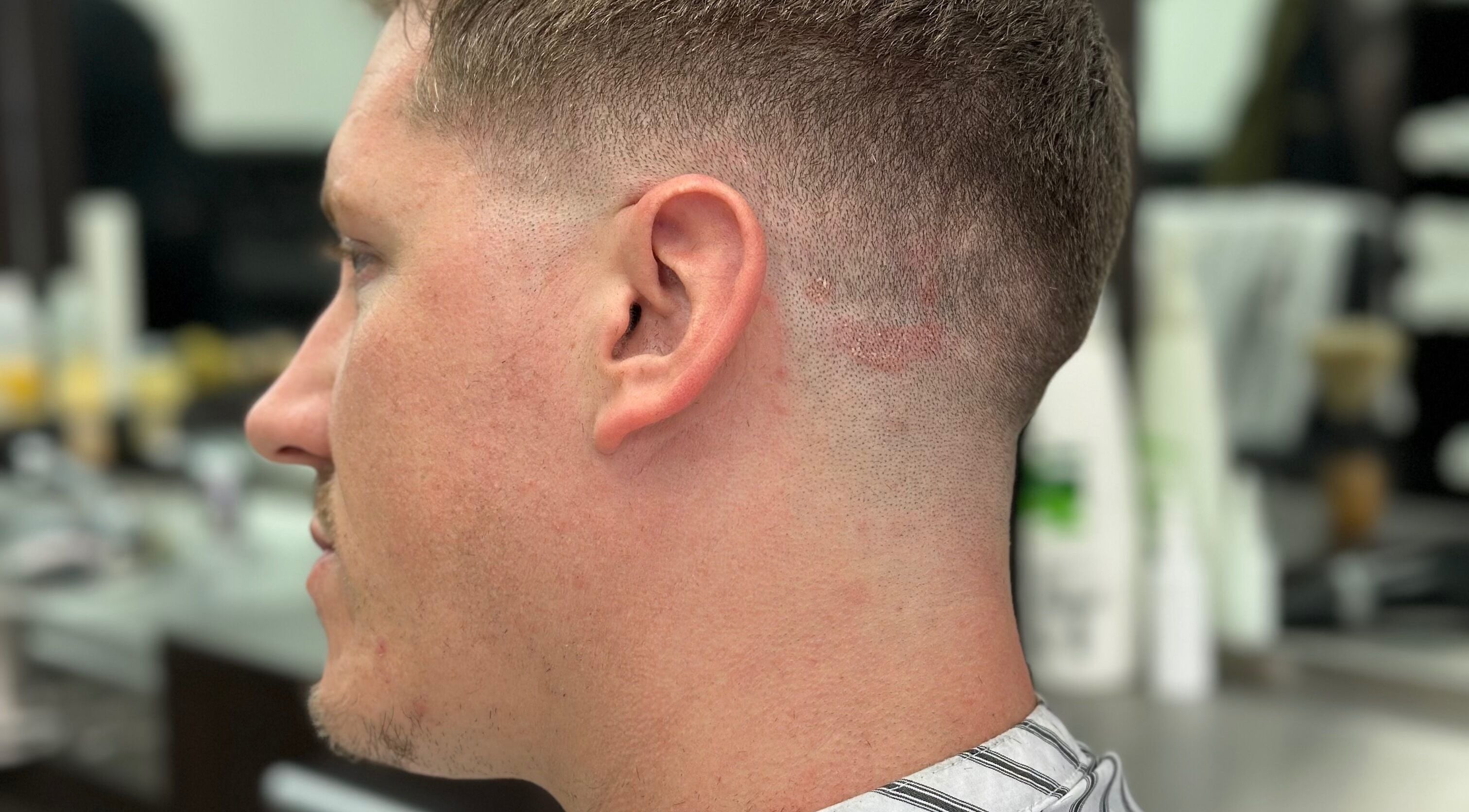 Close-up of a man's fresh fade haircut at Golden Scissors, Birmingham, England, GB.