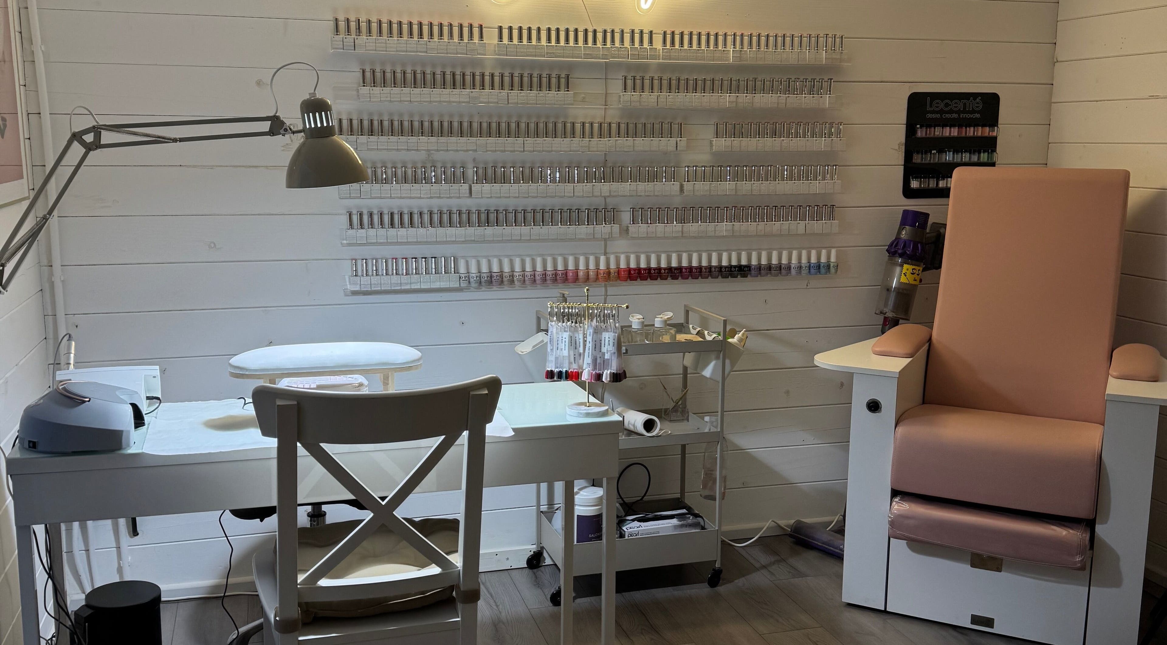Nail station at Beautique Beauty Studio in Warninglid, England, GB, showcasing a cozy and modern setup.