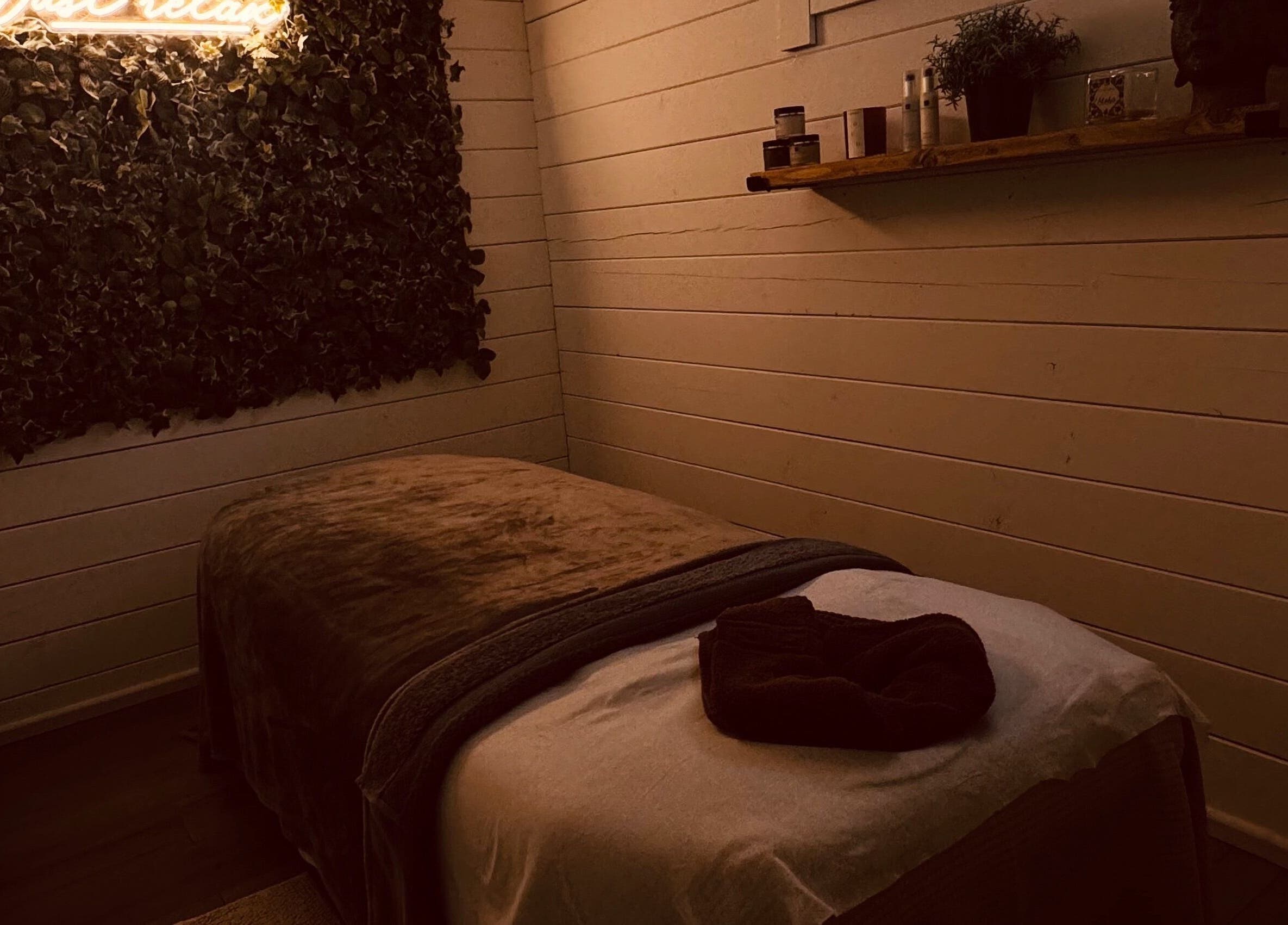 Tranquil treatment room at Beautique Beauty Studio, Warninglid, England, GB with plush bed and cozy ambiance.