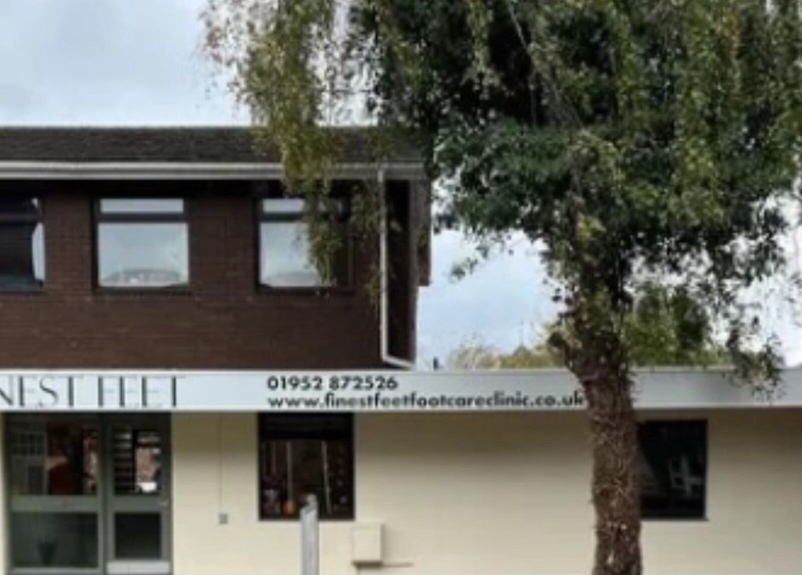 Exterior of ByWildflowerBeauty in Shifnal, England, GB, showcasing a welcoming entry and surrounding greenery.