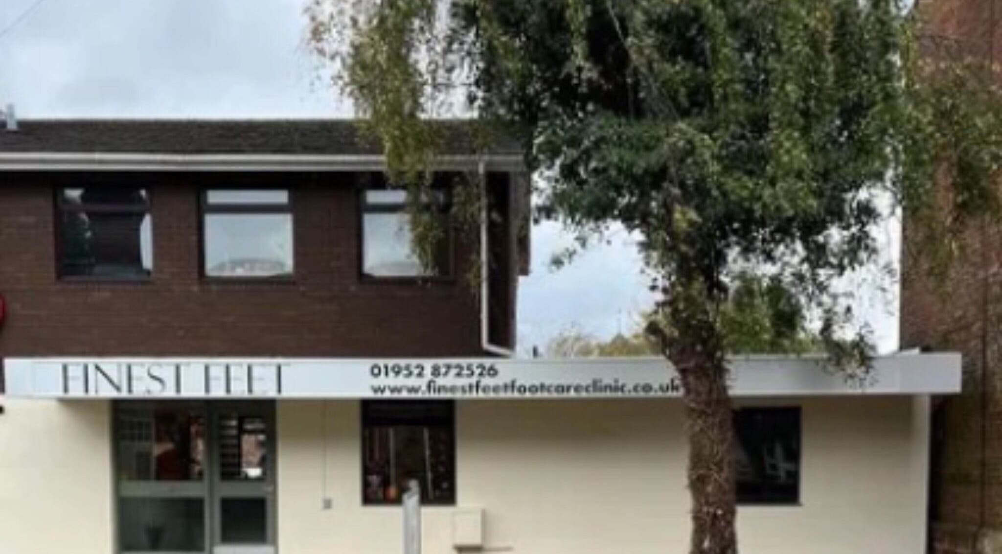 Exterior of ByWildflowerBeauty in Shifnal, England, GB, showcasing a welcoming entry and surrounding greenery.